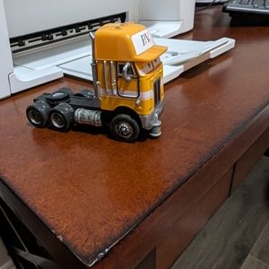 Disney Pixar Truck Cab. No trailer. Peterbilt name on bottom. Die cast.